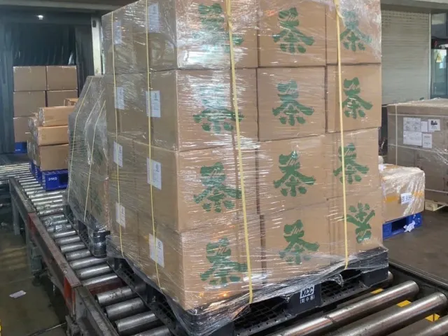 Export sacks of Vietnamese black tea being loaded into a container at Goo Farm Tea Vietnam